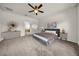 Cozy main bedroom features a ceiling fan, soft carpet, and calming decor for a relaxing retreat at 15810 Starling Water Dr, Lithia, FL 33547