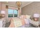 Charming bedroom with modern bed, pastel wall and light fixture, offering a cozy and stylish retreat at 1724 Longliner Loop, Wesley Chapel, FL 33543