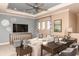 Cozy living room with comfortable seating, work space and decorative details, designed for relaxation and productivity at 1724 Longliner Loop, Wesley Chapel, FL 33543