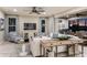Bright and airy living room with stylish decor and seamless indoor-outdoor living space at 1724 Longliner Loop, Wesley Chapel, FL 33543