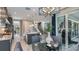 Contemporary kitchen with an island, stylish lighting, marble floors, and backyard views at 1738 Longliner Loop, Wesley Chapel, FL 33543