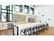 Stylish community kitchen with stainless steel appliances, island seating, and natural light at 1738 Longliner Loop, Wesley Chapel, FL 33543