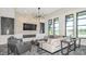 Cozy lounge featuring a modern stone wall, fireplace, and comfortable seating at 1738 Longliner Loop, Wesley Chapel, FL 33543