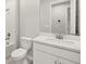 A modern bathroom with a toilet, shower and tub combo, and single sink at 20417 Symphony Pl, Venice, FL 34293