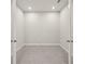 Neutral room showcases recessed lighting, tile floor and ample space at 20417 Symphony Pl, Venice, FL 34293