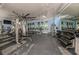 Well-equipped fitness center with treadmills, weights, and mirrored wall at 20417 Symphony Pl, Venice, FL 34293