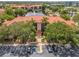 Aerial view of the community buildings with a large lake and fountain nearby at 2400 Feather Sound Dr # 1136, Clearwater, FL 33762