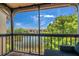 The screened porch features scenic views of the lake and lush greenery at 2400 Feather Sound Dr # 1136, Clearwater, FL 33762