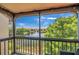 The screened-in patio features views of the lush landscaping and lake at 2400 Feather Sound Dr # 1136, Clearwater, FL 33762