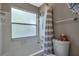 Bathroom with a toilet and shower/tub with frosted windows at 2400 Feather Sound Dr # 1136, Clearwater, FL 33762
