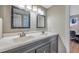Well-lit bathroom with double sinks, modern fixtures, and framed mirrors at 2400 Feather Sound Dr # 1136, Clearwater, FL 33762