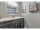 Bathroom with a sink and cabinets and a mirror, plus towel rack at 2400 Feather Sound Dr # 1136, Clearwater, FL 33762