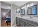 Bathroom with double sinks and access to bedroom at 2400 Feather Sound Dr # 1136, Clearwater, FL 33762