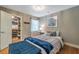 Comfortable bedroom featuring a spacious closet with custom shelving and storage solutions at 2400 Feather Sound Dr # 1136, Clearwater, FL 33762