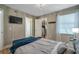 Relaxing bedroom boasts natural light, modern fixtures, and convenient TV mount at 2400 Feather Sound Dr # 1136, Clearwater, FL 33762