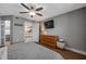This is a bedroom with wood-look floors and a ceiling fan and neutral walls at 2400 Feather Sound Dr # 1136, Clearwater, FL 33762