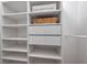 Custom closet featuring built-in shelving and storage for optimal organization at 2400 Feather Sound Dr # 1136, Clearwater, FL 33762
