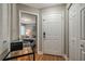 Home entryway showcasing the bedroom, decorative chest, and white doors at 2400 Feather Sound Dr # 1136, Clearwater, FL 33762