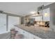 Modern kitchen features a granite countertop island and stainless steel appliances at 2400 Feather Sound Dr # 1136, Clearwater, FL 33762