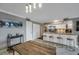 Modern kitchen view with a bar that has four chairs and stainless steel appliances at 2400 Feather Sound Dr # 1136, Clearwater, FL 33762
