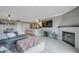 Open concept living space with a fireplace, entertainment center, and kitchen area at 2400 Feather Sound Dr # 1136, Clearwater, FL 33762