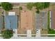 An aerial shot showcasing the property's roof, surrounding yards, and neighborhood layout at 24305 Denali Ct, Lutz, FL 33559
