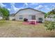 Spacious backyard featuring a cozy patio area, perfect for outdoor dining and entertaining at 24305 Denali Ct, Lutz, FL 33559