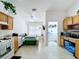 Traditional kitchen features a gas range, dining nook, and a view to the laundry room at 24305 Denali Ct, Lutz, FL 33559