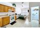 Traditional kitchen with dining nook including a gas range and white appliances at 24305 Denali Ct, Lutz, FL 33559