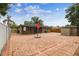 Wide shot of a cozy backyard that features a brick patio at 2701 W Osborne Ave, Tampa, FL 33614