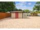 The backyard offers a brick patio and tool shed at 2701 W Osborne Ave, Tampa, FL 33614