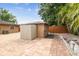 Backyard featuring a tool shed, and brick patio at 2701 W Osborne Ave, Tampa, FL 33614