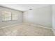 Bedroom with tile floor, window with blinds and neutral paint at 2701 W Osborne Ave, Tampa, FL 33614