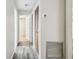 A bright hallway with modern floors and closet doors at 2701 W Osborne Ave, Tampa, FL 33614