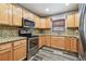 Close-up view of the kitchen's stainless steel appliances and granite countertops at 2701 W Osborne Ave, Tampa, FL 33614