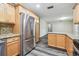 An open kitchen layout featuring granite countertops and stainless steel appliances at 2701 W Osborne Ave, Tampa, FL 33614