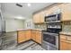 A modern kitchen featuring stainless steel appliances and light-colored cabinetry at 2701 W Osborne Ave, Tampa, FL 33614