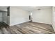 Large room with plank flooring and stairway with decorative railing at 2701 W Osborne Ave, Tampa, FL 33614
