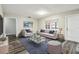 Living room with engineered floors, neutral decor, and lots of natural light at 2701 W Osborne Ave, Tampa, FL 33614