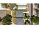 Aerial view showcasing gray-roofed houses with surrounding neighborhood and ample parking at 2906 E Columbus Dr, Tampa, FL 33605