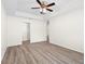 Large bedroom featuring tray ceilings, a ceiling fan, recessed lighting, and a walk-in closet at 2906 E Columbus Dr, Tampa, FL 33605