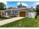 Lovely home with a one-car garage and a long driveway, perfect for extra parking at 2906 E Columbus Dr, Tampa, FL 33605
