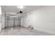 Bright garage featuring concrete floors, an automatic door opener, and access to the home at 2906 E Columbus Dr, Tampa, FL 33605
