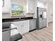 Updated kitchen featuring modern appliances, sleek countertops, and white cabinets at 2906 E Columbus Dr, Tampa, FL 33605