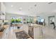 Spacious kitchen with an island, stainless steel appliances, and access to the outdoor living area at 30214 Skylark Dr, Wesley Chapel, FL 33545