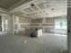 Unfinished living room with rough walls, large windows, and an open-concept design, offering customization potential at 32249 Tribeca Ave, Wesley Chapel, FL 33543