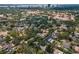 A captivating aerial view of a neighborhood with lush trees, and diverse housing options at 3416 W Morrison Ave, Tampa, FL 33629