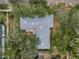 Aerial view of the roof, yard and mature trees at 3416 W Morrison Ave, Tampa, FL 33629