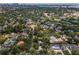Aerial view of a well-established neighborhood with mature trees, varied home styles, and neighborhood streets at 3416 W Morrison Ave, Tampa, FL 33629
