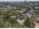 An aerial view of a tree-filled neighborhood showcasing diverse homes and landscaping at 3416 W Morrison Ave, Tampa, FL 33629